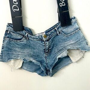 Distressed shorts with peek out pockets